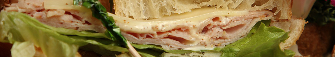 Eating Deli Sandwich at Milano's Deli restaurant in Jersey City, NJ.